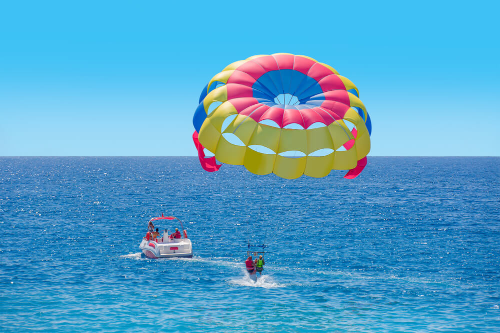People parasailing in Panama City Beach.