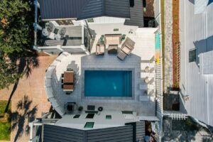 An overhead view of a 30A vacation rental with a pool to stay at when attending local events.