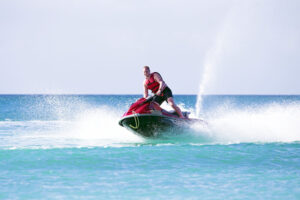 A person riding one one of the jet ski rentals available in Panama City Beach.
